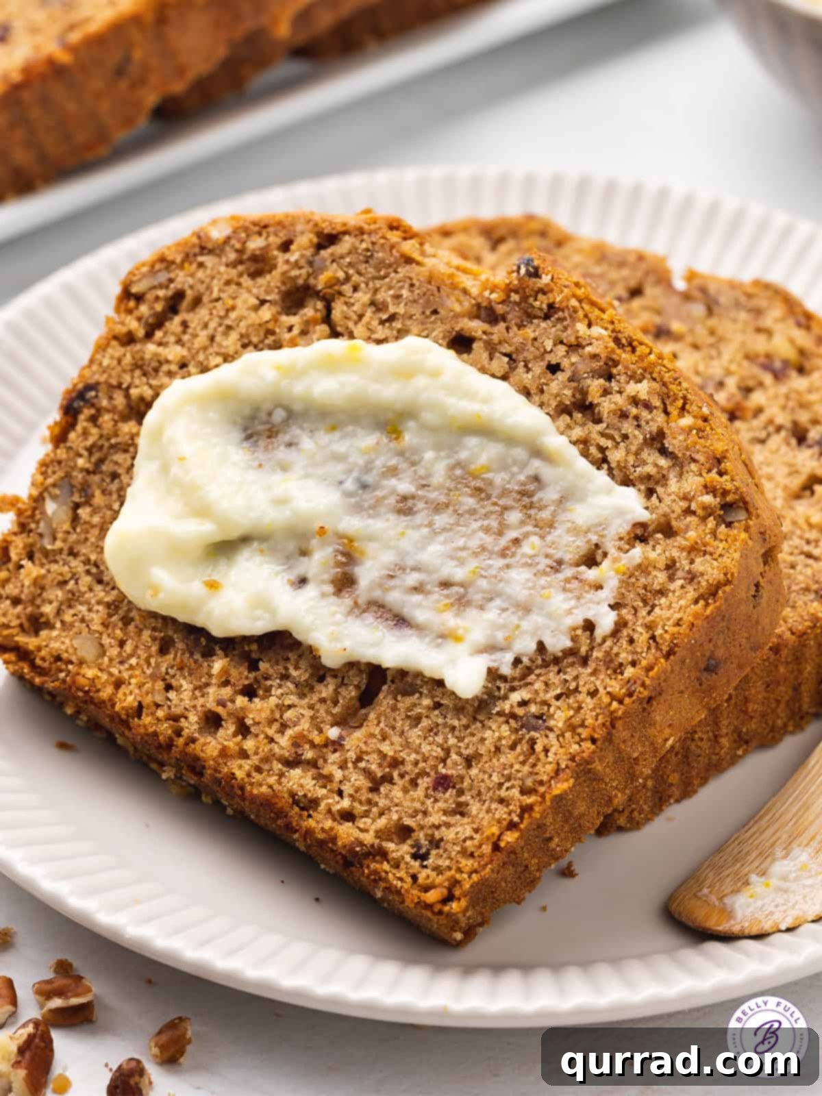 Sweet Date and Nut Loaf 12 Slice of date bread with a swipe of butter.