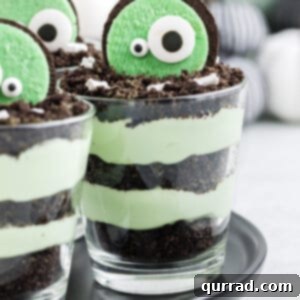 Halloween dirt pudding cups on a black platter