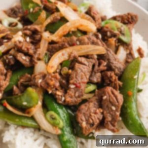 Korean beef bulgogi with peppers and peas served over rice