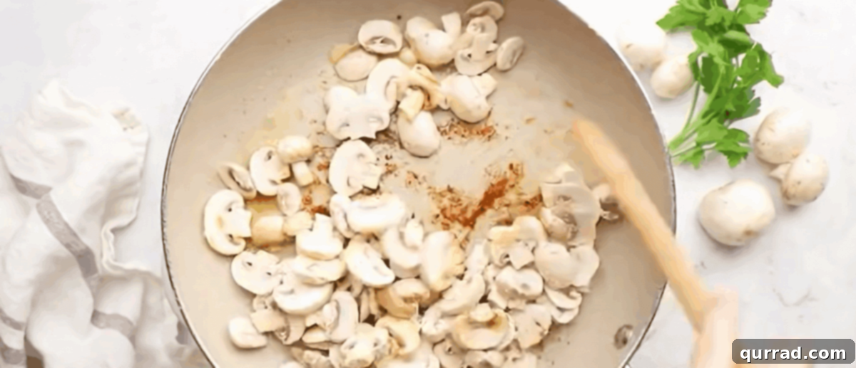Creamy Boursin Chicken 5 Cooking the mushrooms in a skillet until golden brown.