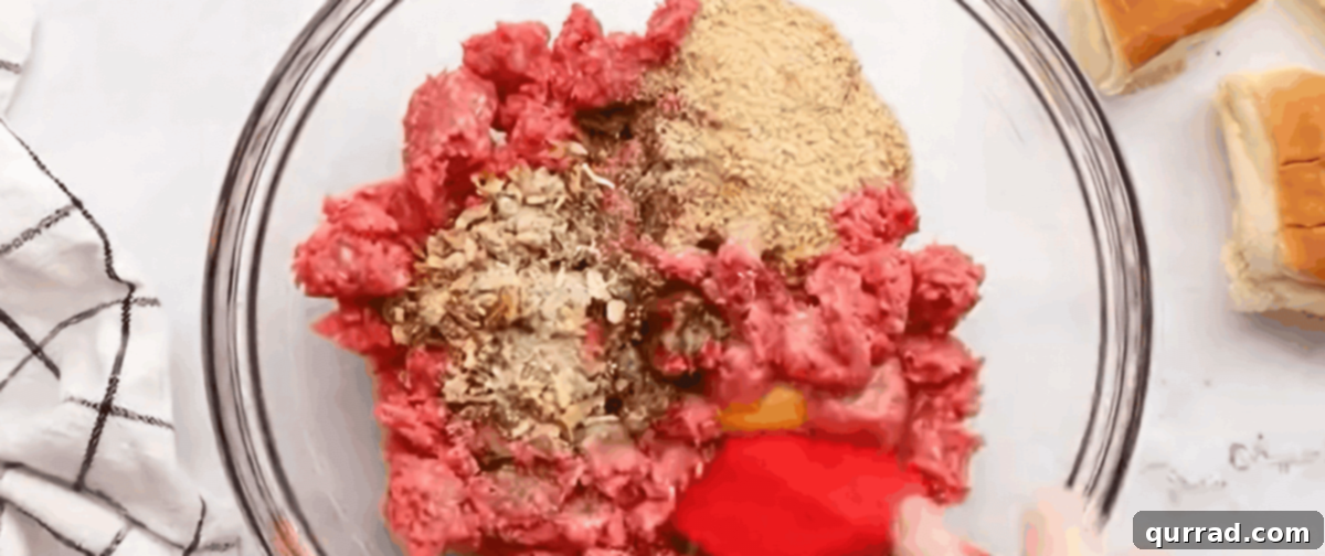 White Castle: The Original American Slider 3 A bowl with ground beef, bread crumbs, egg, onion soup mix, milk, and pepper, all ready to be combined for the White Castle burger mixture.