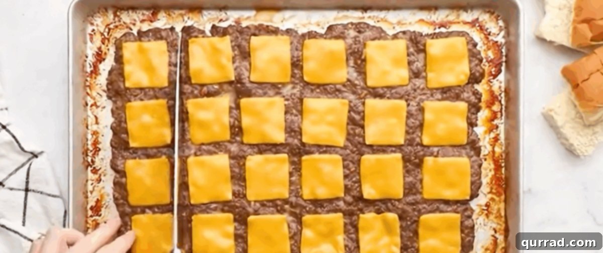 White Castle: The Original American Slider 6 A sharp knife slicing through the cooked, cheese-topped meat slab along the scored lines, separating it into individual burger patties.