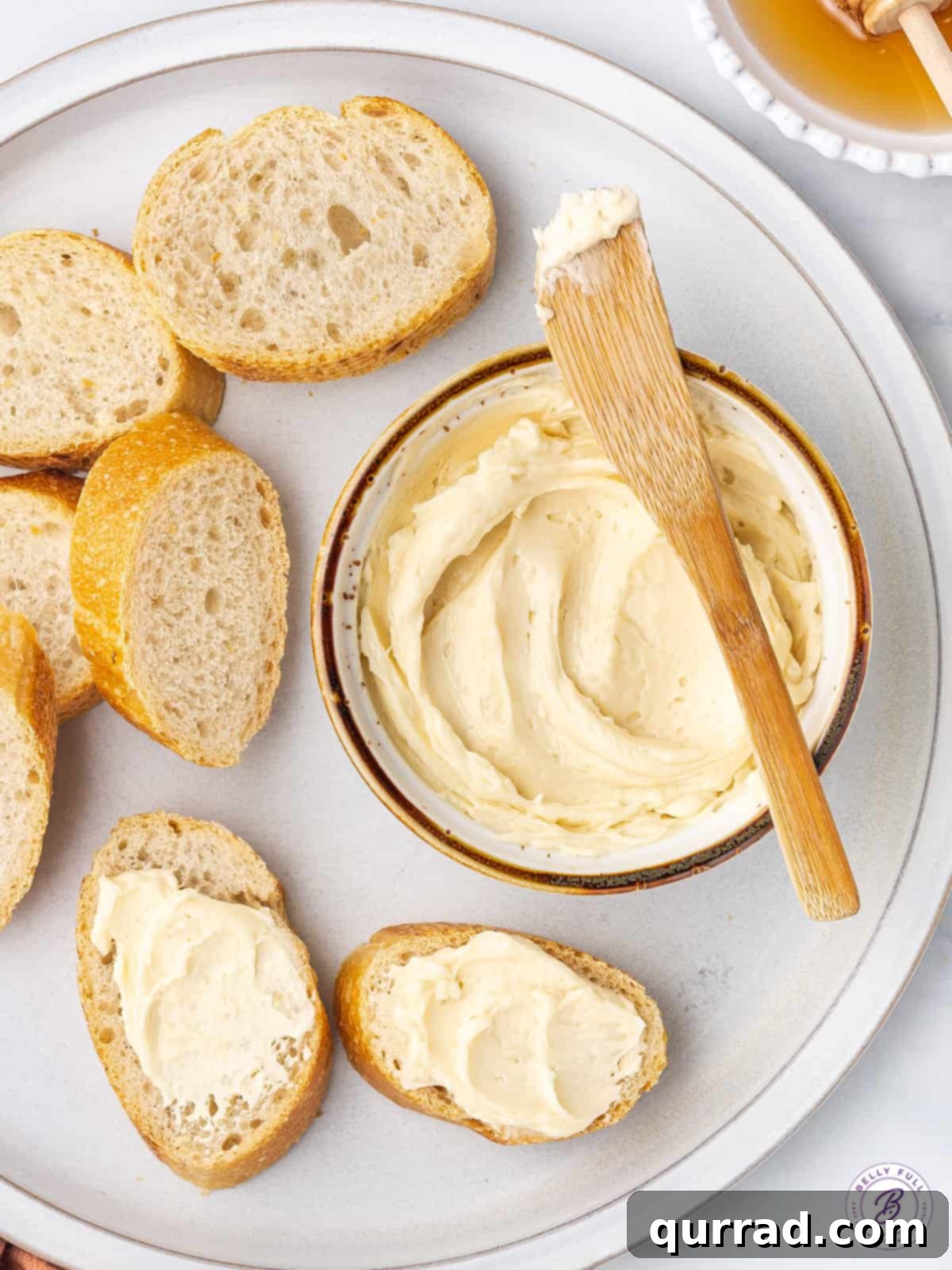 overhead ramekin of butter with butter knife