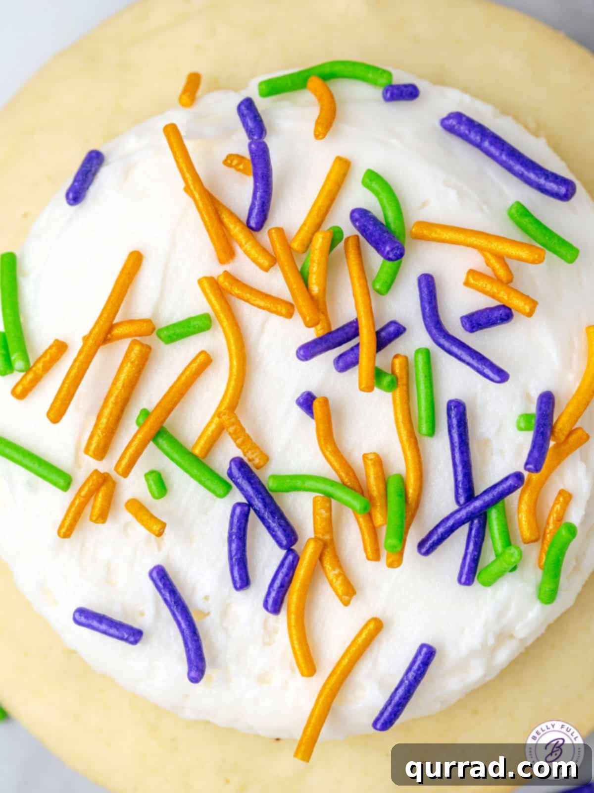 Vibrant Mardi Gras Lofthouse Cookies 5 close up frosted cookies with purple, green, and gold sprinkles
