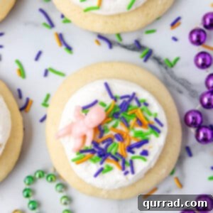 Mardi Gras Lofthouse Cookie with sprinkles and plastic toy doll