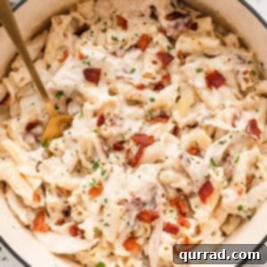 Loaded Chicken Bacon Ranch Pasta 2 A spoon stirring chicken bacon ranch pasta