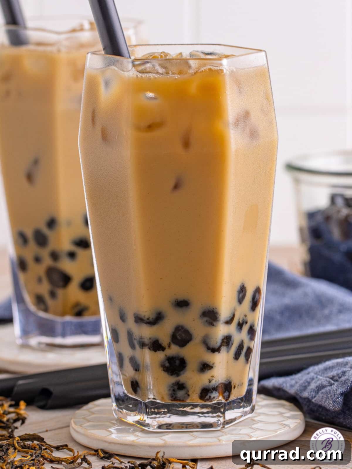 Spring Festival 7 A refreshing glass of homemade boba tea with a straw, revealing the chewy tapioca pearls at the bottom, perfect for a summer day or a festive meal.