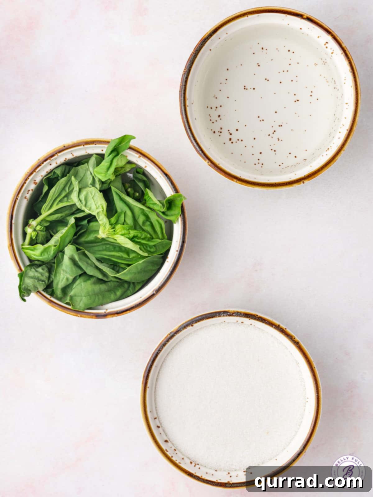 This Basil Simple Syrup is a great way to add sweet, earthy flavor to any cocktail or drink. Made with just 3 ingredients! Overhead view of ingredients needed for basil infused simple syrup