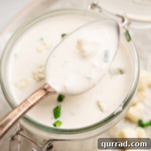 Bold Blue Dressing 2 A spoon of blue cheese over a jar of it