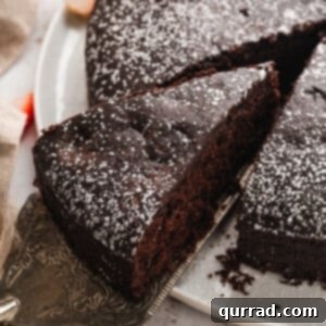 Decadent Vegan Chocolate Bliss 2 A slice of eggless chocolate cake being served