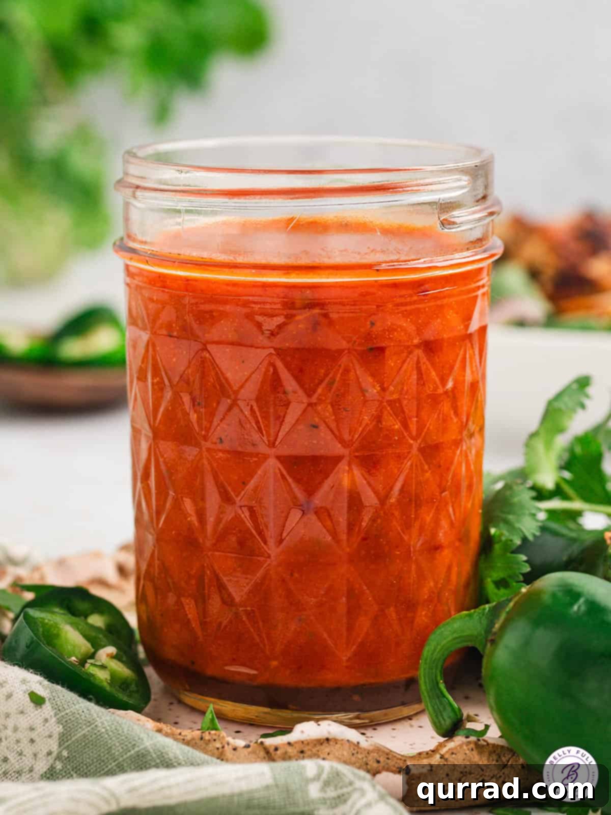 Chipotle honey vinaigrette is smokey and spicy with a tiny hint of sweetness. It's perfect for dressing salads, marinating meat, and more. Chipotle honey vinaigrette in a jar, showcasing its rich color and smooth texture.