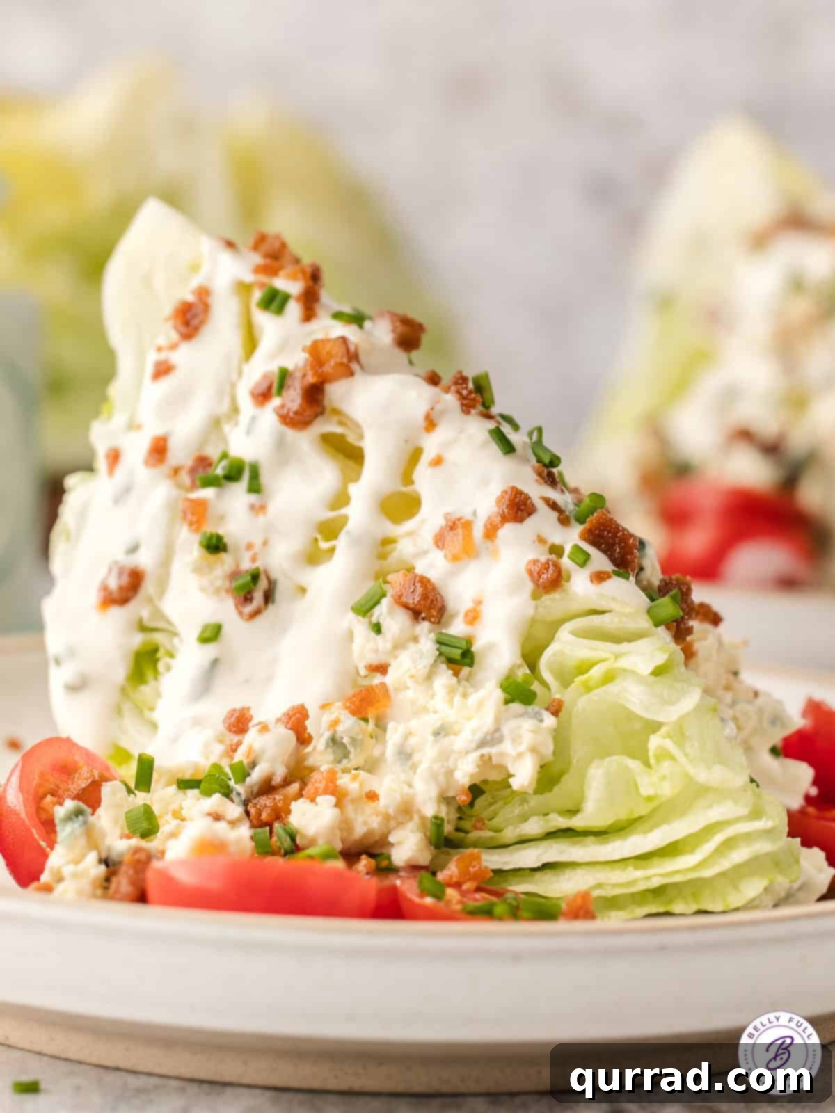 Big Crunch, Big Flavor 2 A beautifully presented Wedge Salad, generously topped with creamy dressing, crispy bacon bits, and vibrant cherry tomatoes.