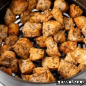 Air Fryer Pork Poppers 2 Pork chop bites in the air fryer, cooked and ready to serve