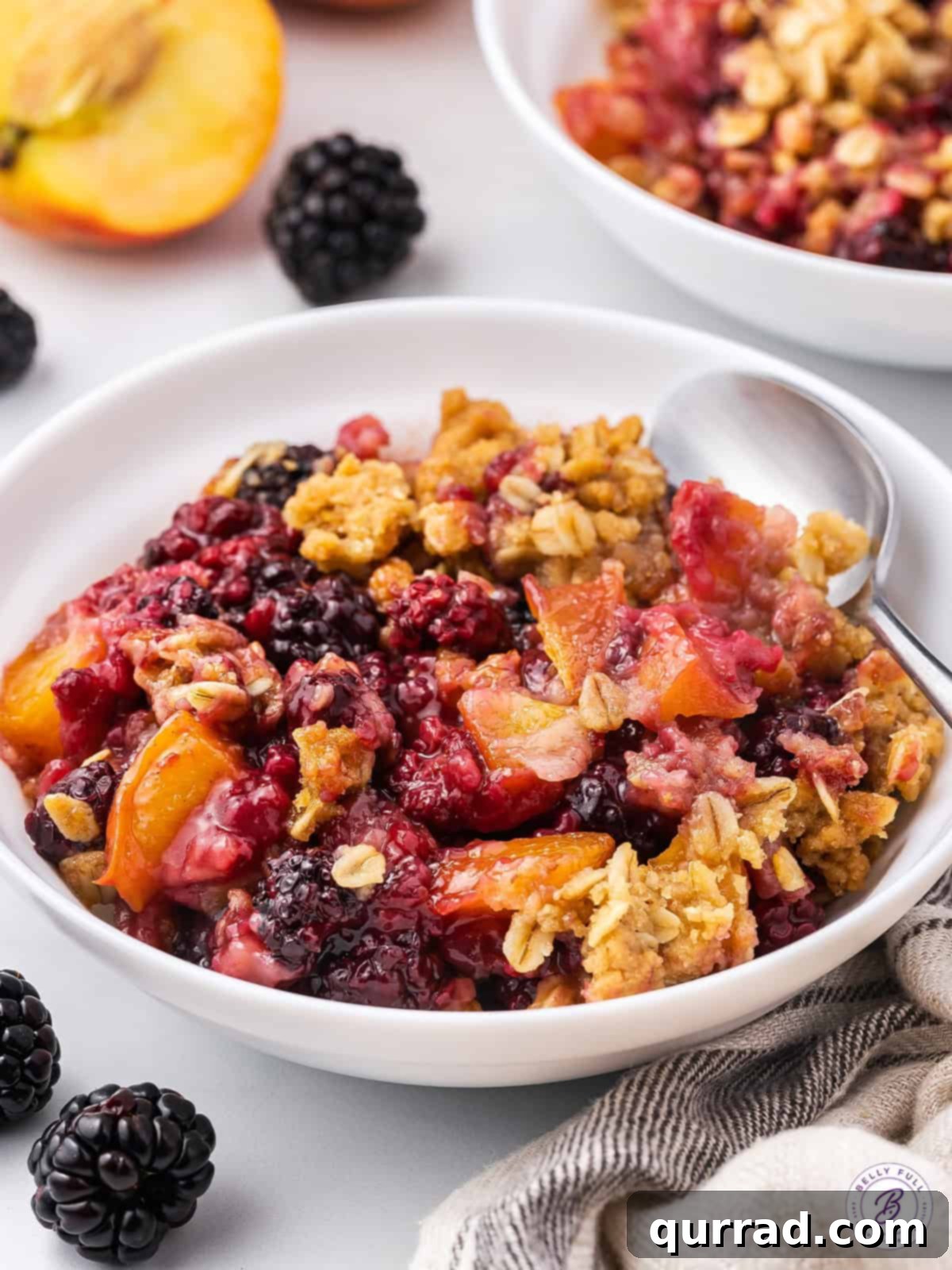 Golden Blackberry Peach Crumble 2 bowl of fruit crisp dessert with blackberries and peaches