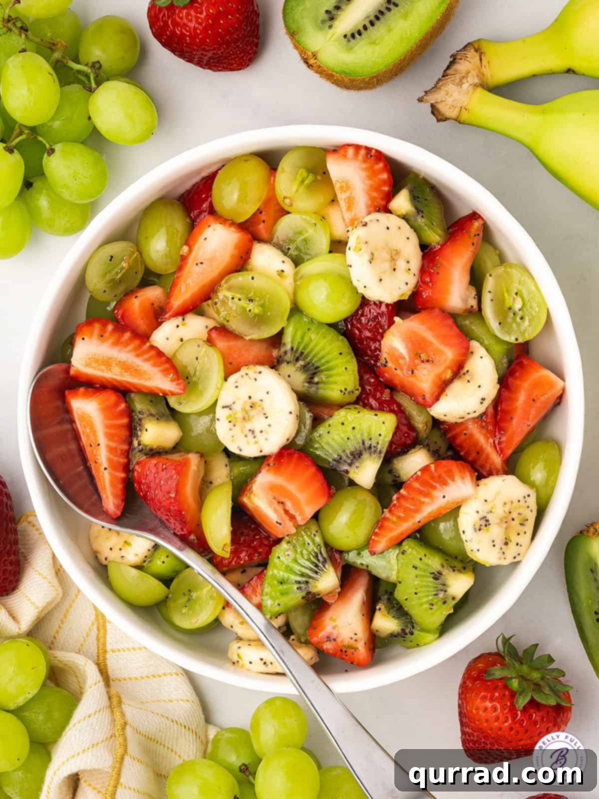 Vibrant Honey-Lime Fruit Medley 2 overhead close up of fresh fruit salad with poppy seed dressing