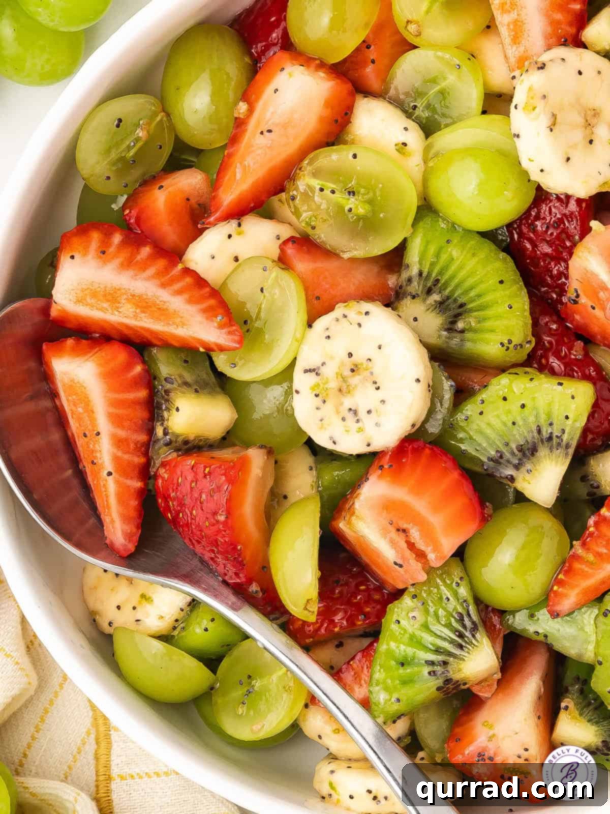 Vibrant Honey-Lime Fruit Medley 5 overhead close up of fresh fruit salad with poppy seed dressing