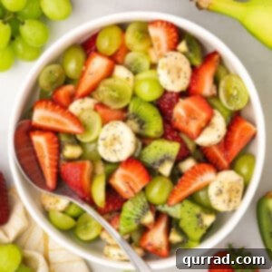 Vibrant Honey-Lime Fruit Medley 6 overhead close up of fresh fruit salad with poppy seed dressing