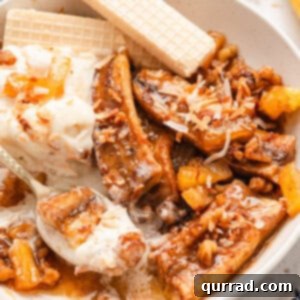 A bowl of pineapple bananas foster dessert, ready to be enjoyed.