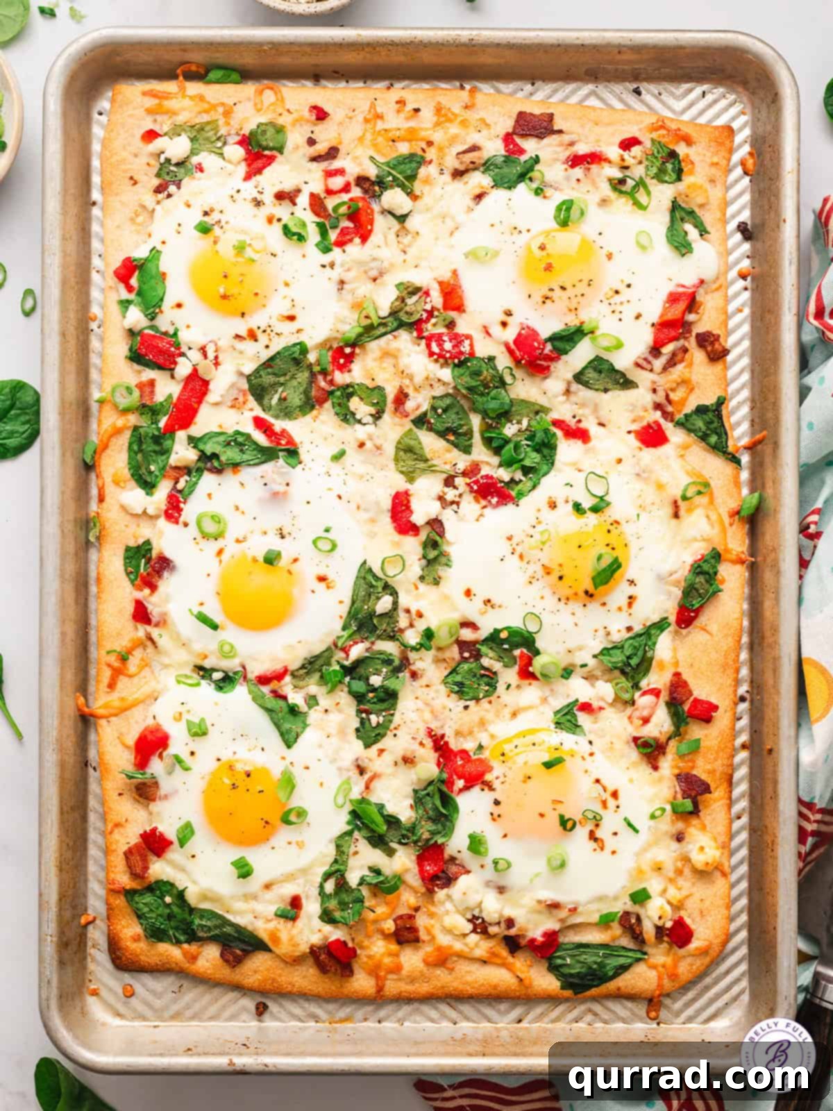Easy Breakfast Pizza recipe with eggs, veggies, and cheese, perfect for sharing Delicious Sheet Pan Breakfast Pizza with eggs, veggies, and cheese