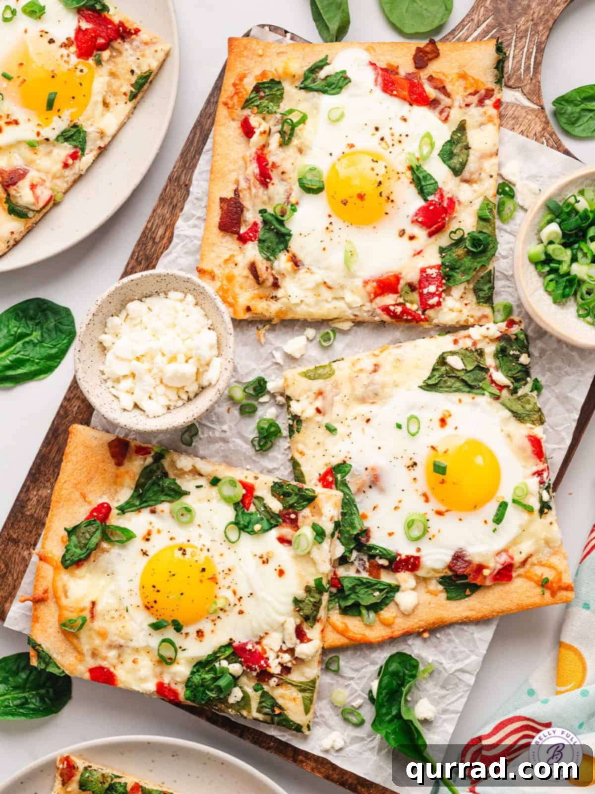 Perfectly portioned breakfast pizza slices, ideal for any morning meal Slices of sheet pan breakfast pizza arranged on a baking sheet, ready to serve