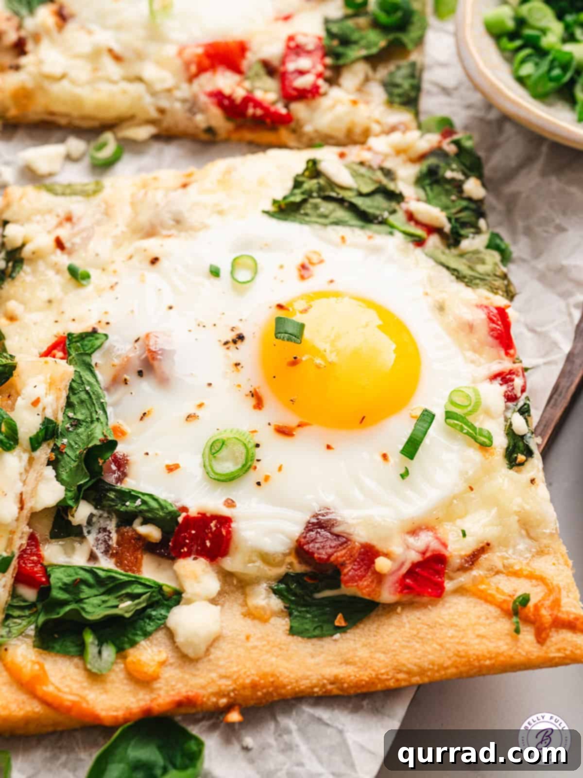 Appetizing close-up of a breakfast pizza slice, ready to be enjoyed Close up view of a single slice of breakfast pizza, highlighting the runny yolk and crispy crust