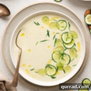 Overhead view of a bowl of cold cucumber soup