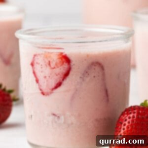 A glass of strawberries and cream agua fresca