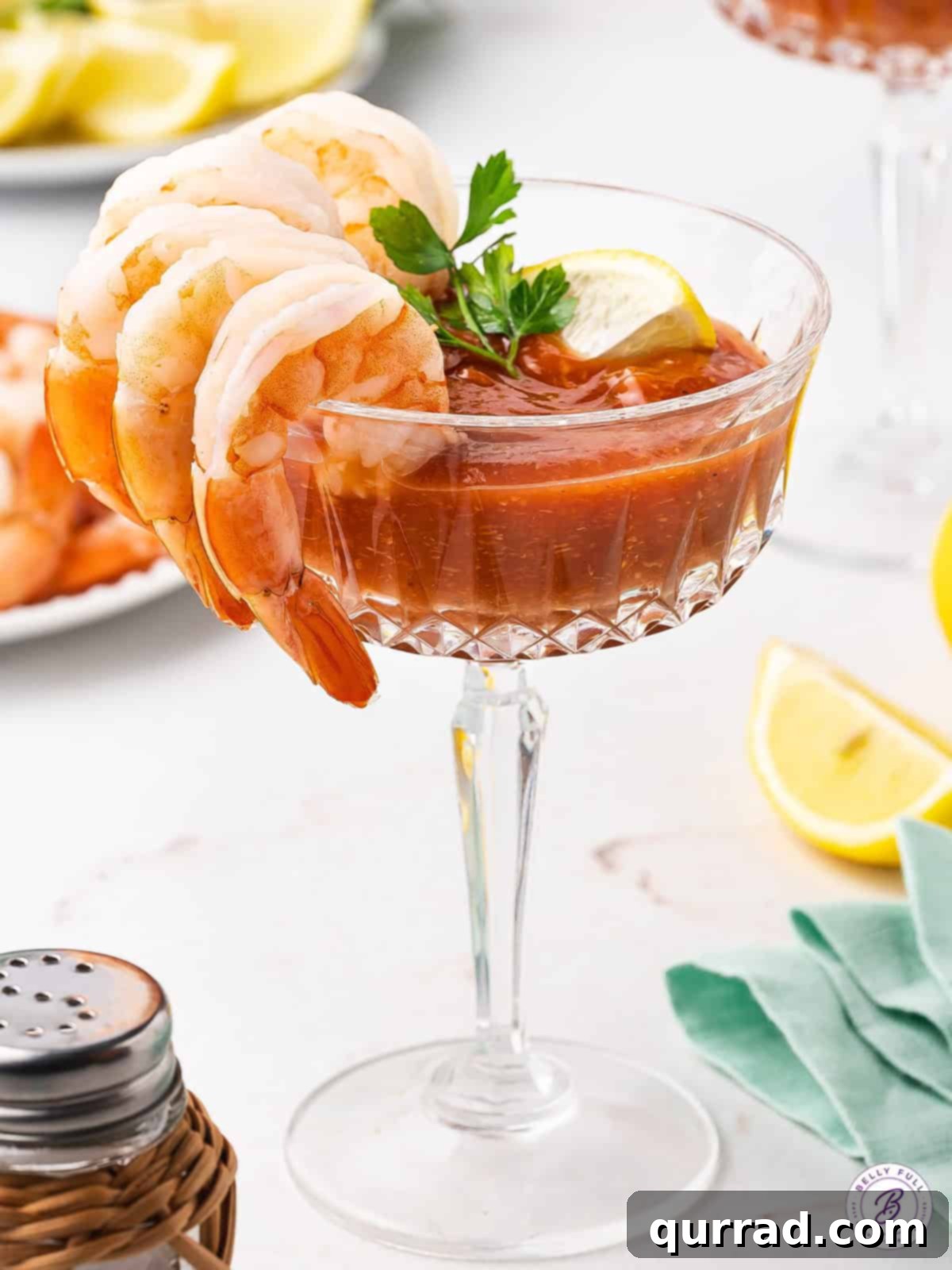 Enjoy the classic shrimp cocktail experience with homemade sauce. Shrimp cocktail in a cocktail glass with homemade sauce