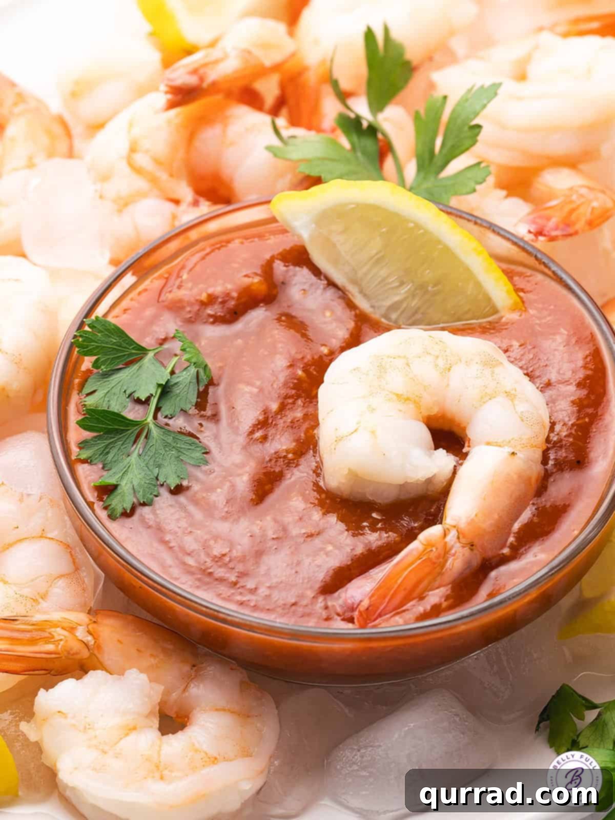 Perfectly crafted homemade cocktail sauce for your next meal. A dish of cocktail sauce surrounded by shrimp