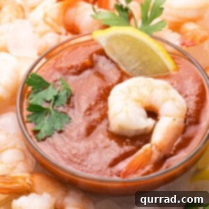 Tangy Seafood Dip 2 A dish of cocktail sauce surrounded by shrimp