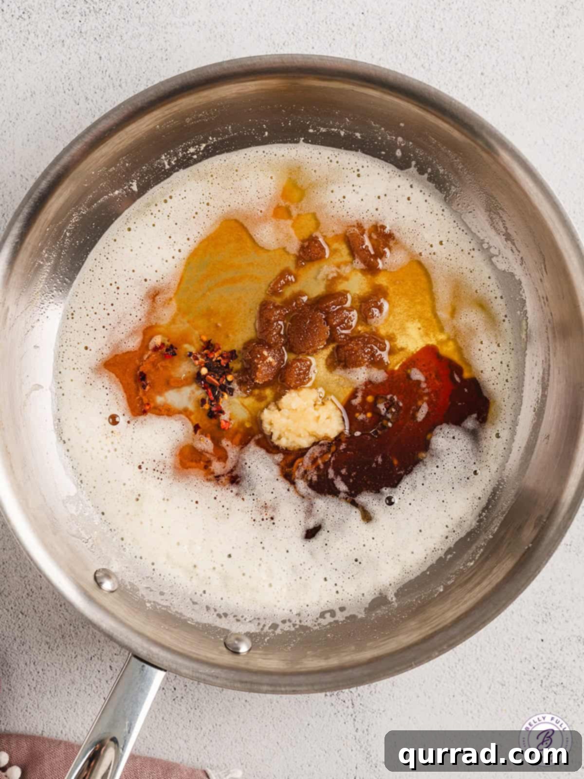 Infinity sauce is a savory brown butter soy sauce filled with nutty umami flavor. Enjoy over pork, chicken, veggies, and more. Brown butter soy sauce ingredients in a pan