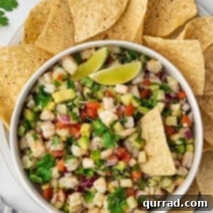 overhead bowl of shrimp ceviche surrounded by tortilla chips