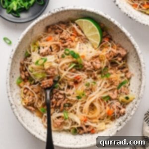Overhead view of a bowl of Filipino pancit