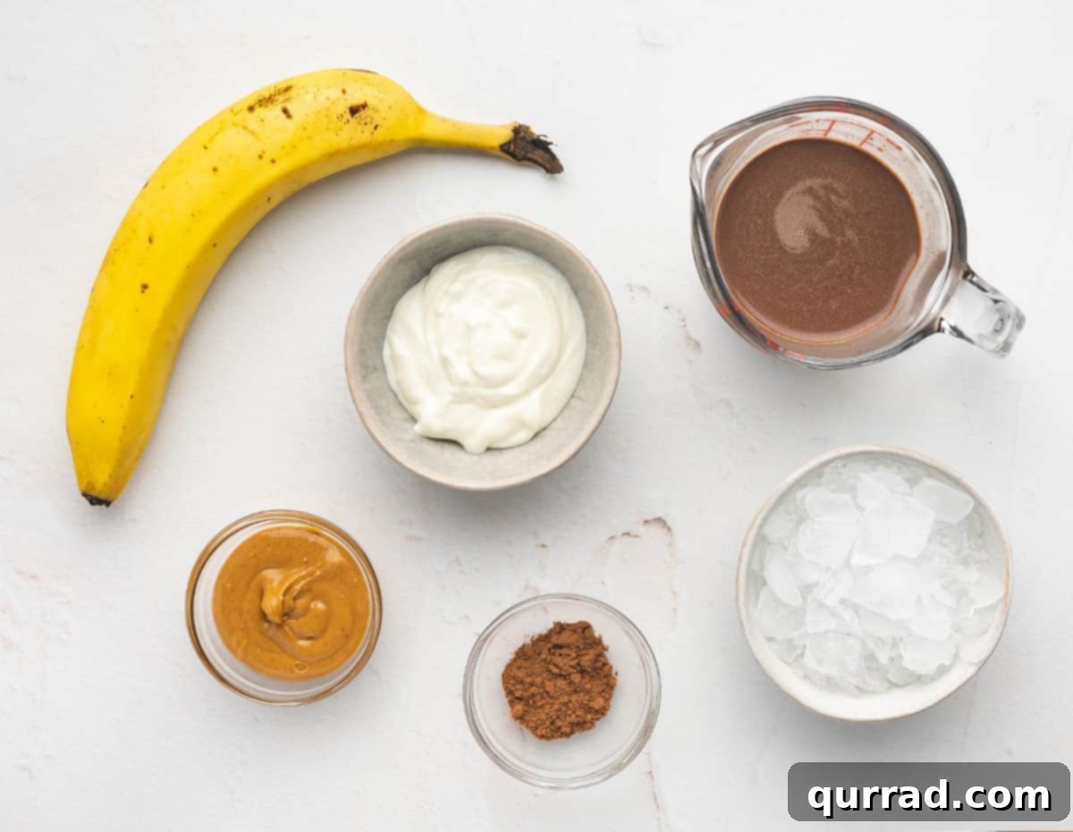 All the fresh ingredients laid out on a wooden board, ready to be blended into a delicious chocolate banana smoothie.