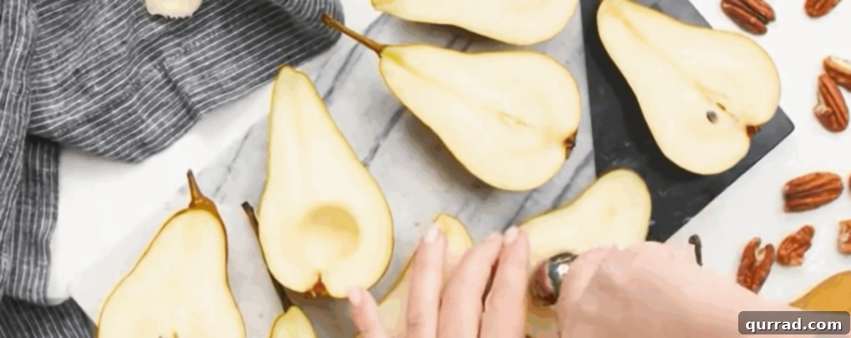Warm Pear Delight 3 A visual guide showing pears being carefully sliced in half and then cored to remove seeds, preparing them for baking.