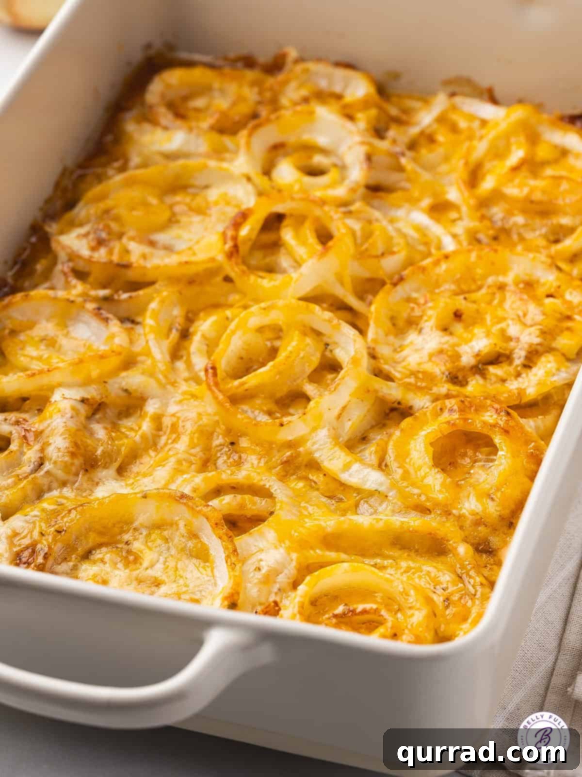A large casserole dish filled with baked Tennessee onions, ready for serving.