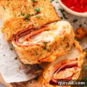 Overhead view of a stromboli with a slice pieces sliced off