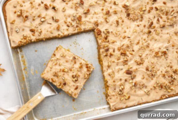 A beautifully frosted pumpkin sheet cake, ready for slicing