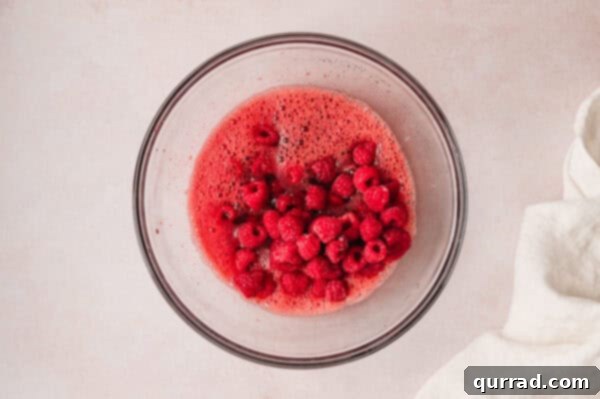 Crimson Snowcap Gelatin 8 Frozen raspberries mixed into raspberry jello