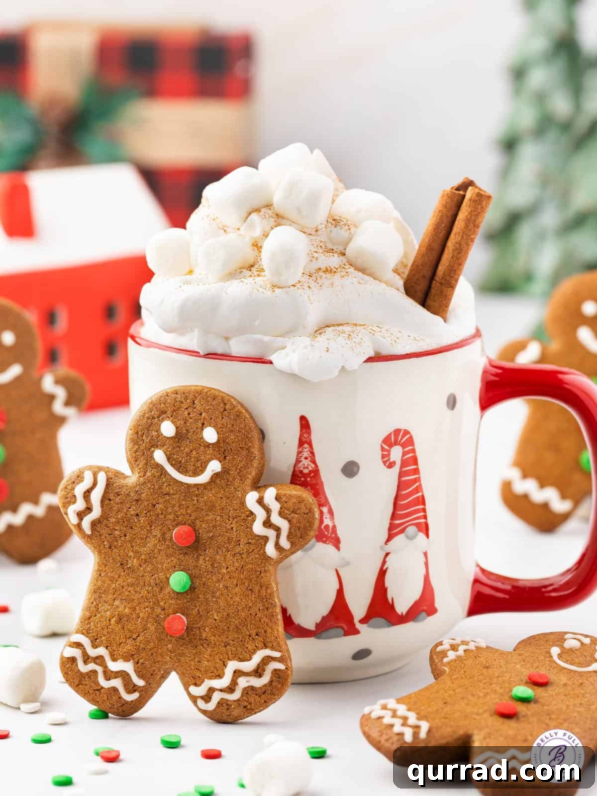 A festive scene with a decorated gingerbread man cookie leaning against a steaming mug of hot cocoa.