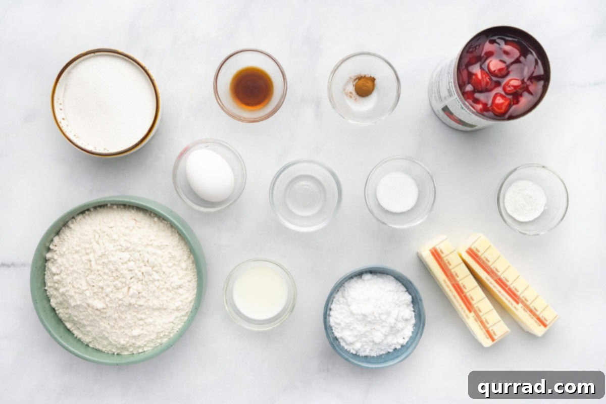 Ingredients for Easy Cherry Pie Bars: flour, sugar, butter, egg, vanilla, almond extract, and cherry pie filling. An overhead shot showing all the essential ingredients laid out on a kitchen counter, necessary for baking delicious cherry pie bars.