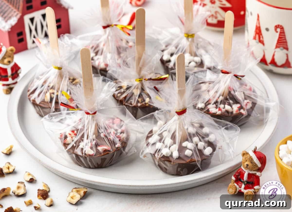 A plate of hot chocolate on a stick individually wrapped in cellophane, ready for gifting.