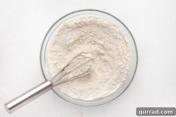 Whisking dry cookie ingredients together