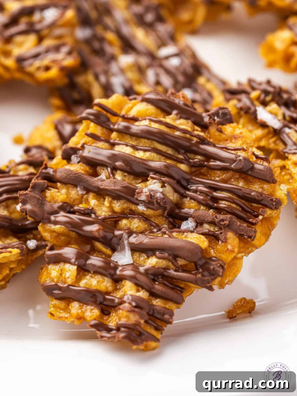 Crispy Cornflake Chocolate Bark 5 Close-up shot of a single piece of cornflake chocolate brittle, showing the crisp cornflakes and glossy chocolate