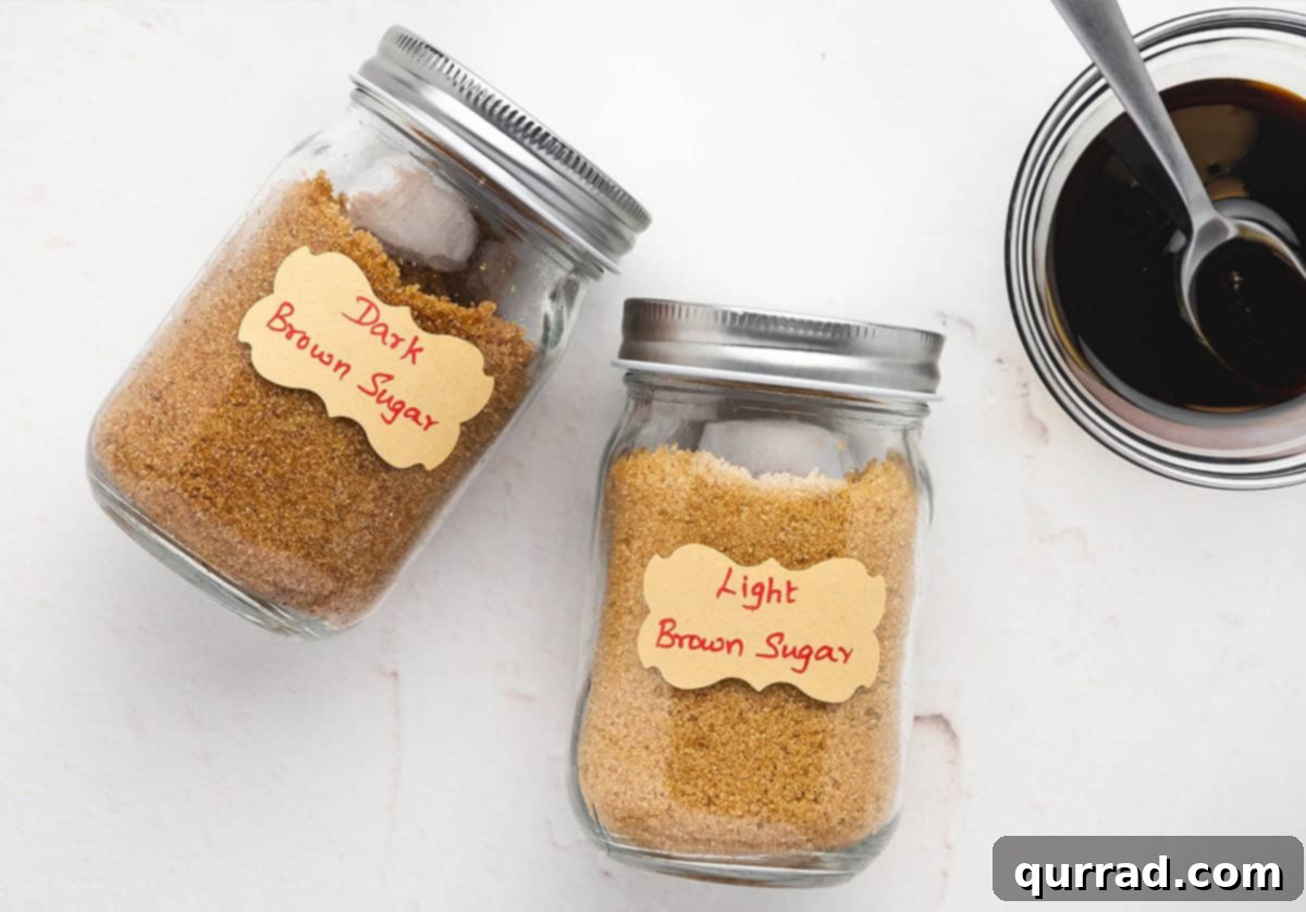 Two jars of homemade brown sugar, one light and one dark