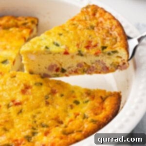 Serving a slice of baked Denver omelet