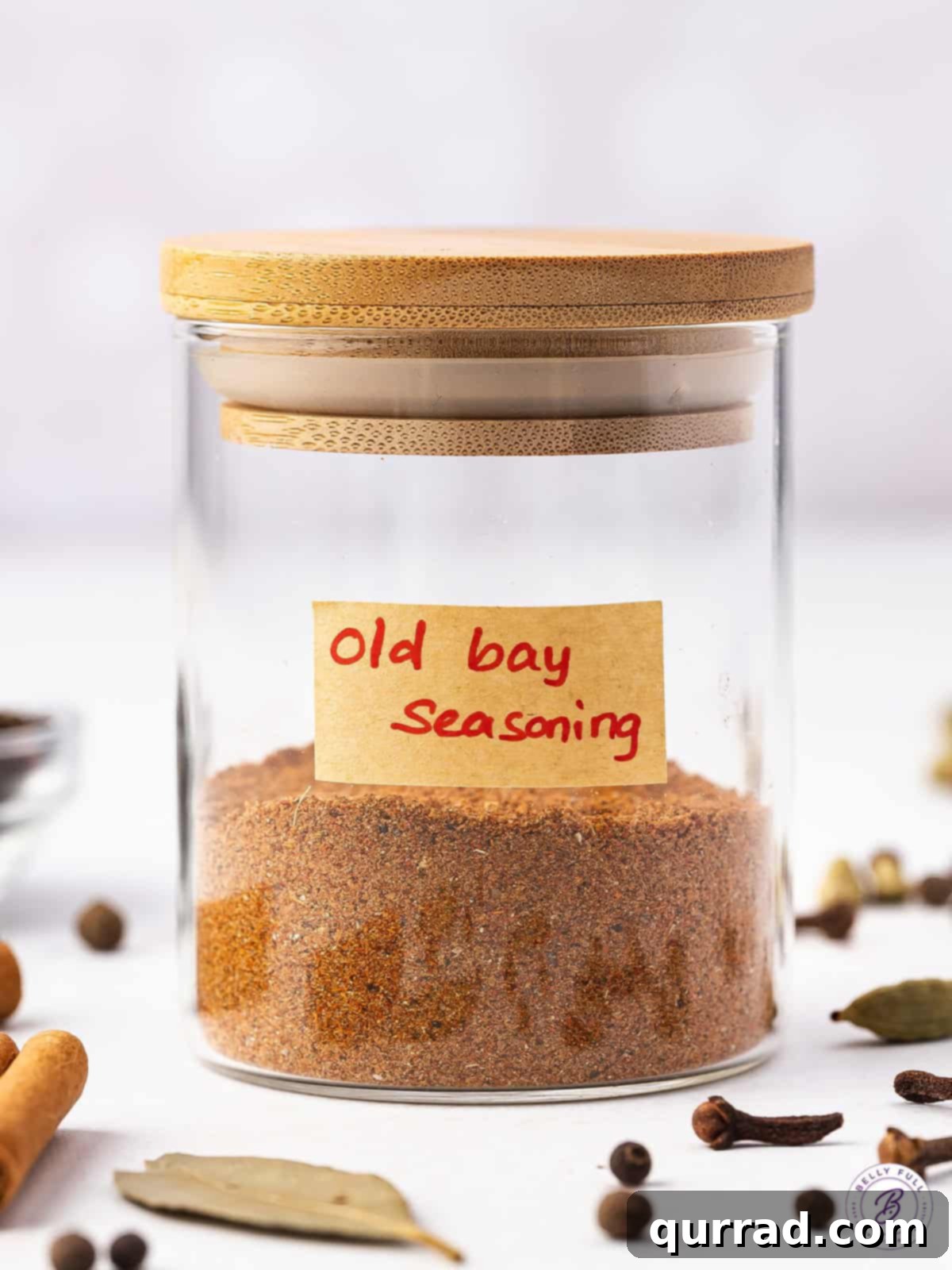 Homemade Old Bay Seasoning: Sweet, Savory, and Spicy Blend Perfect for Seafood and Beyond. A jar of freshly made homemade Old Bay seasoning, showcasing its vibrant orange-red hue.