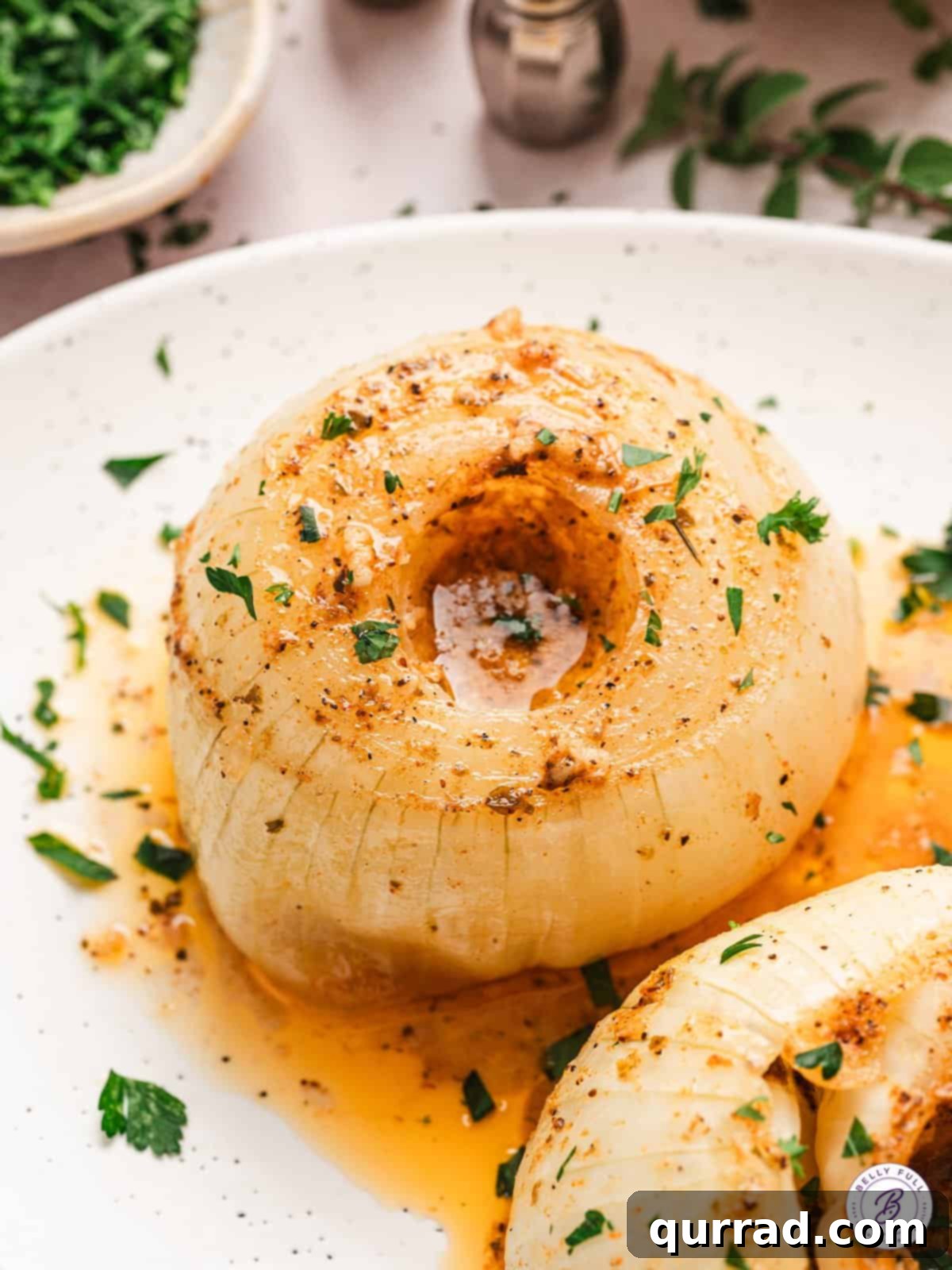 A sweet Vidalia onion is coated with butter, spices, and garlic and then baked in foil in this Onion Boil recipe. Simple & versatile! Close up of an onion boil