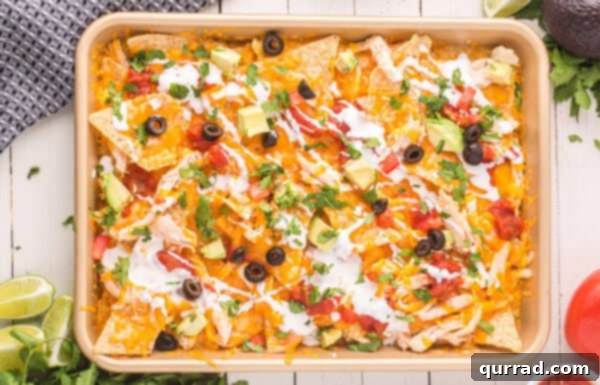 Loaded Chicken Nachos 7 A pan of chicken nachos fresh from the oven