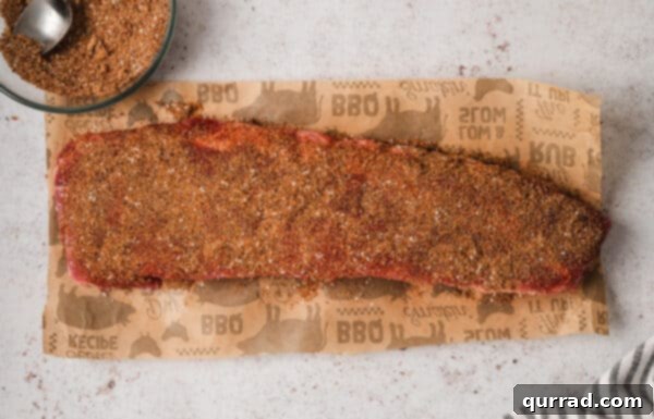 Fall-Off-The-Bone Baked Ribs 7 A rack of ribs generously coated with a spice rub